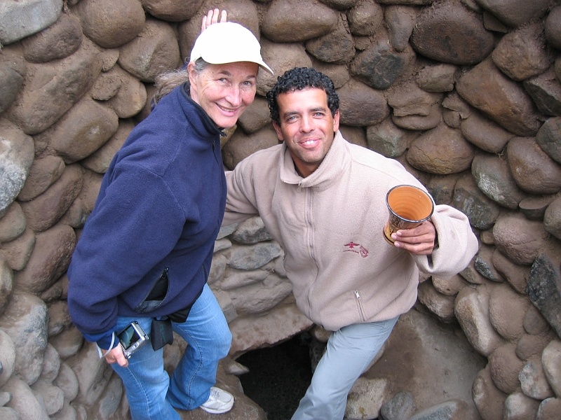 0806190002.JPG - Day 13, Thursday, June 19, Nazca.  Our guide invites us to taste the mountain spring water from an ancient underground aqueduct.